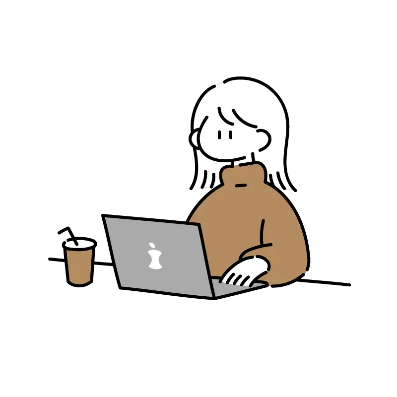 女の子がパソコンの前に座って作業している